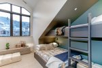 The right side of the room features twin and queen beds